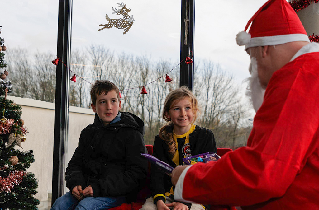 Kids meeting Father Christmas at The Dockers' grotto